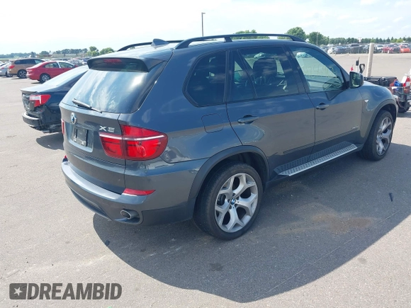 2012 BMW X5 35d with VIN 5UXZW0C56CL664575, listed as a IAAI auction lot 42559674 with 157,554 mi miles and . Bid and sale history available at DreamBid. Image 4.