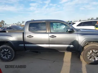 2021 Toyota Tacoma SR5 z VIN 3TMDZ5BN6MM110938, wystawiony jako IAAI lot #41838703 z przebiegiem 67 680 mil mil oraz . Historia ofert i sprzedaży dostępna na DreamBid. Obrazek 13.