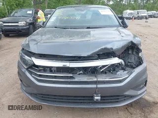 2021 Volkswagen Jetta SEL Premium z VIN 3VWG57BU8MM017203, wystawiony jako IAAI lot #42263741 z przebiegiem 26 556 mil mil oraz . Historia ofert i sprzedaży dostępna na DreamBid. Obrazek 12.