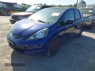 2009 Honda Fit with VIN JHMGE88279S071667, listed as a IAAI auction lot 42035664 with 235,791 mi miles. Bid and sale history available at carsss.com. Image 2.
