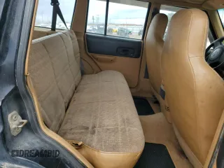 1998 Jeep Cherokee Sport with VIN 1J4FJ68S6WL188802, listed as a Copart auction lot 52094005 with 199,586 mi miles and Salvage Title. Bid and sale history available at carsss.com. Image 11.