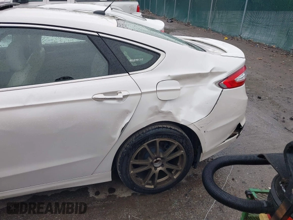 2016 Ford Fusion Titanium with VIN 3FA6P0K98GR369433, listed as a IAAI auction lot 42214785 with 64,918 mi miles and . Bid and sale history available at DreamBid. Image 6.