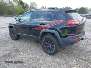 2015 Jeep Cherokee Trailhawk with VIN 1C4PJMBS5FW792184, listed as a IAAI auction lot 41827106 with 132,752 mi miles. Bid and sale history available at carsss.com. Image 3.