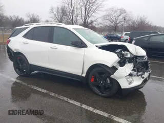 2021 Chevrolet Equinox Premier z VIN 2GNAXNEV7M6112087, wystawiony jako IAAI lot #41102702 z przebiegiem 32 995 mil mil oraz . Historia ofert i sprzedaży dostępna na DreamBid. Obrazek 1.