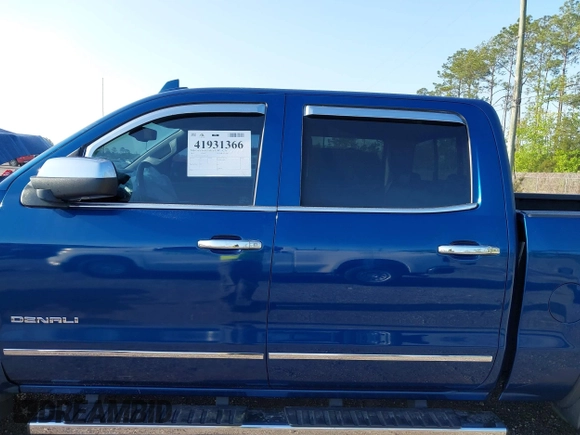 2015 GMC Sierra 1500 Denali z VIN 3GTP1WEC2FG201307, wystawiony jako IAAI lot #41931366 z przebiegiem 99 644 mil mil oraz . Historia ofert i sprzedaży dostępna na DreamBid. Obrazek 13.