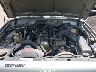 2000 Jeep Cherokee z VIN 1J4FF48S5YL138739, wystawiony jako IAAI lot #42109922 z przebiegiem 199 621 mil mil oraz . Historia ofert i sprzedaży dostępna na DreamBid. Obrazek 10.