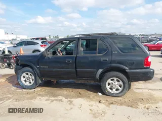 2001 Isuzu Rodeo S with VIN 4S2CK58W114363340, listed as a IAAI auction lot 41498698 with 185,408 mi miles and . Bid and sale history available at DreamBid. Image 14.