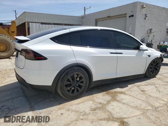 2022 Tesla Model X with VIN 7SAXCBE52NF362994, listed as a Copart auction lot 49850475 with 55,506 mi miles and Salvage Title. Bid and sale history available at DreamBid. Image 3.