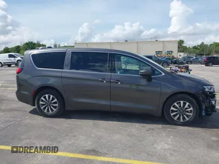 2023 Chrysler Pacifica Hybrid Touring L with VIN 2C4RC1L74PR579782, listed as a IAAI auction lot 42487390 with Not provided miles and . Bid and sale history available at DreamBid. Image 14.
