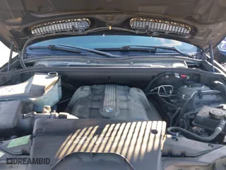 2004 BMW X5 4.4i with VIN 5UXFB53504LV06486, listed as a IAAI auction lot 41674534 with 164,974 mi miles. Bid and sale history available at carsss.com. Image 10.
