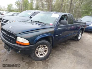 2002 Dodge Dakota Sport with VIN 1B7GL32X12S561414, listed as a IAAI auction lot 42060300 with 235,957 mi miles. Bid and sale history available at carsss.com. Image 2.