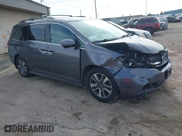 2016 Honda Odyssey Touring Elite z VIN 5FNRL5H99GB072860, wystawiony jako IAAI lot #42157603 z przebiegiem 221 449 mil mil oraz . Historia ofert i sprzedaży dostępna na DreamBid. Obrazek 1.