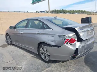 2013 Hyundai Sonata Hybrid with VIN KMHEC4A42DA089524, listed as a IAAI auction lot 41233221 with 114,636 mi miles. Bid and sale history available at carsss.com. Image 3.