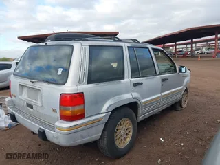 1995 Jeep Grand Cherokee Limited with VIN 1J4GZ78Y3SC649231, listed as a IAAI auction lot 41763953 with 140,889 mi miles. Bid and sale history available at carsss.com. Image 4.