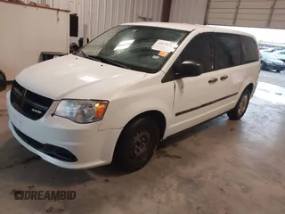 2014 Ram Cargo Van Tradesman with VIN 2C4JRGAG9ER186052, listed as a IAAI auction lot 41879655 with 239,442 mi miles. Bid and sale history available at carsss.com. Image 2.
