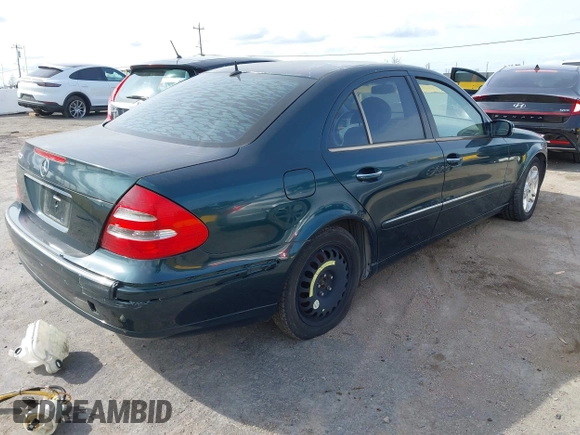 2003 Mercedes-Benz E-Class 3.2L with VIN WDBUF65J23X111728, listed as a IAAI auction lot 41965931 with 85,524 mi miles. Bid and sale history available at carsss.com. Image 4.