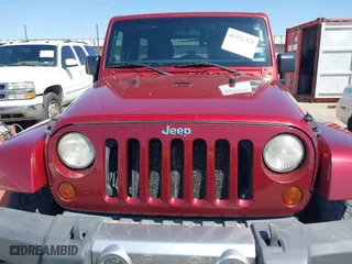 2011 Jeep Wrangler Unlimited Sahara with VIN 1J4BA5H15BL557871, listed as a IAAI auction lot 41922328 with 206,581 mi miles. Bid and sale history available at carsss.com. Image 6.