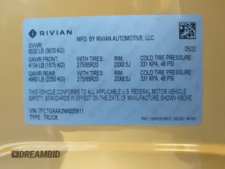 2022 Rivian R1T Adventure Package with VIN 7FCTGAAA2NN005811, listed as a IAAI auction lot 41706558 with 21,336 mi miles. Bid and sale history available at carsss.com. Image 9.