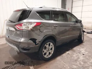 2014 Ford Escape Titanium with VIN 1FMCU9JX9EUA56421, listed as a IAAI auction lot 41392372 with 117,234 mi miles. Bid and sale history available at carsss.com. Image 4.