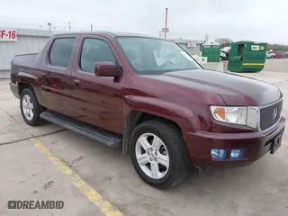 2014 Honda Ridgeline RTL with VIN 5FPYK1F52EB010700, listed as a IAAI auction lot 41490401 with 180,947 mi miles. Bid and sale history available at carsss.com. Image 1.