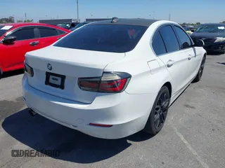 2012 BMW 3 Series 328i with VIN WBA3A5C50CF342206, listed as a IAAI auction lot 42008940 with 130,164 mi miles. Bid and sale history available at carsss.com. Image 4.