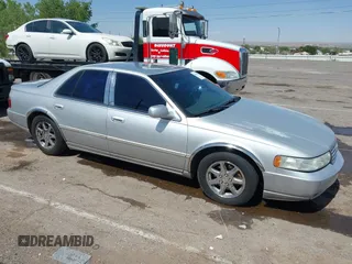 2003 Cadillac Seville Luxury SLS z VIN 1G6KS54Y43U214795, wystawiony jako IAAI lot #42348542 z przebiegiem 144 438 mil mil oraz . Historia ofert i sprzedaży dostępna na DreamBid. Obrazek 13.