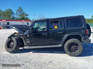 2019 Jeep Wrangler Unlimited Sahara with VIN 1C4HJXEG0KW604937, listed as a IAAI auction lot 40931379 with 94,821 mi miles. Bid and sale history available at carsss.com. Image 14.
