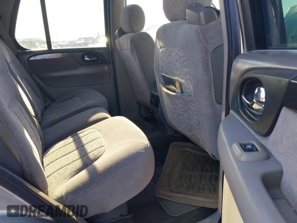 2003 GMC Envoy SLE with VIN 1GKDT13S732168534, listed as a IAAI auction lot 38049193 with 230,894 mi miles. Bid and sale history available at carsss.com. Image 8.
