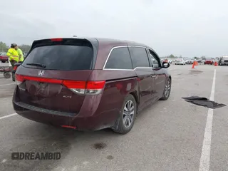 2014 Honda Odyssey Touring with VIN 5FNRL5H94EB127695, listed as a IAAI auction lot 41936109 with 221,786 mi miles and . Bid and sale history available at DreamBid. Image 4.