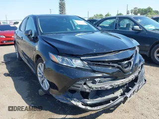 2019 Toyota Camry LE z VIN 4T1B11HK9KU268294, wystawiony jako IAAI lot #42159111 z przebiegiem 106 054 mil mil oraz . Historia ofert i sprzedaży dostępna na DreamBid. Obrazek 1.