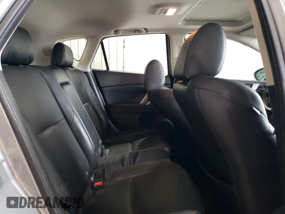 2012 Mazda 3 i Grand Touring with VIN JM1BL1M7XC1659084, listed as a Copart auction lot 49064185 with 104,883 mi miles and Salvage Title. Bid and sale history available at DreamBid. Image 10.