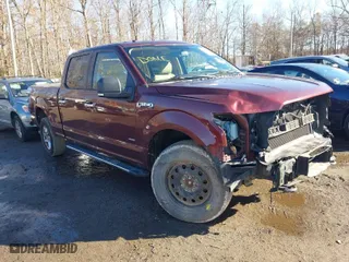 2015 Ford F-150 XLT w/HD Payload Pkg with VIN 1FTFW1EG9FFC44739, listed as a IAAI auction lot 41193582 with 121,169 mi miles. Bid and sale history available at carsss.com. Image 1.