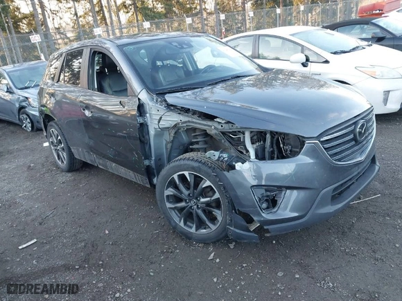 2016 Mazda CX-5 Grand Touring with VIN JM3KE4DY3G0817899, listed as a IAAI auction lot 41287459 with NaN miles. Bid and sale history available at carsss.com. Image 1.