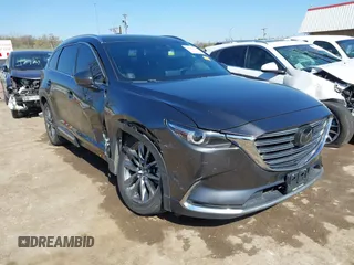 2020 Mazda CX-9 Signature with VIN JM3TCBEY9L0407955, listed as a IAAI auction lot 41984360 with 85,668 mi miles and . Bid and sale history available at carsss.com. Image 1.