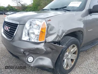 2007 GMC Yukon SLT z VIN 1GKFK13077R129885, wystawiony jako IAAI lot #42184207 z przebiegiem 264 848 mil mil oraz . Historia ofert i sprzedaży dostępna na DreamBid. Obrazek 6.