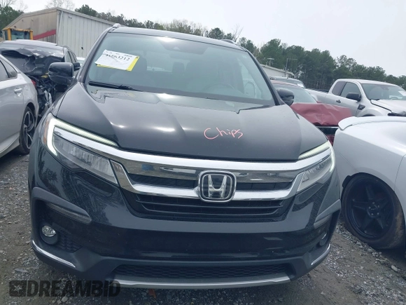 2019 Honda Pilot Touring 7-Passenger z VIN 5FNYF5H66KB027960, wystawiony jako IAAI lot #41863212 z przebiegiem 114 615 mil mil oraz . Historia ofert i sprzedaży dostępna na DreamBid. Obrazek 12.