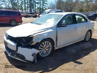2013 Volkswagen Jetta TDI w/Premium with VIN 3VW3L7AJ4DM361445, listed as a IAAI auction lot 41735571 with 133,894 mi miles and . Bid and sale history available at DreamBid. Image 2.