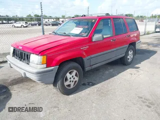 1995 Jeep Grand Cherokee Laredo with VIN 1J4FX58S9SC686074, listed as a IAAI auction lot 42451786 with 82,249 mi miles and . Bid and sale history available at DreamBid. Image 2.