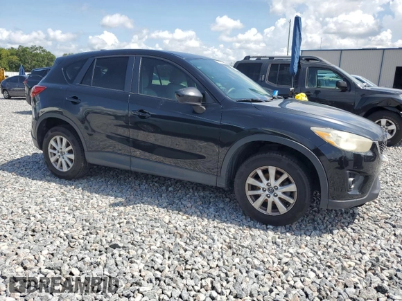 2014 Mazda CX-5 Touring z VIN JM3KE2CY8E0326988, wystawiony jako Copart lot #60473715 z przebiegiem 231 055 mil mil oraz Czysty tytuł • Clean title. Historia ofert i sprzedaży dostępna na DreamBid. Obrazek 4.