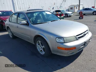 1998 Nissan Maxima GXE z VIN JN1CA21A6WT301301, wystawiony jako IAAI lot #42320257 z przebiegiem 220 271 mil mil oraz . Historia ofert i sprzedaży dostępna na DreamBid. Obrazek 1.