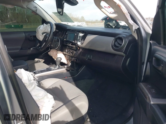 2018 Toyota Tacoma SR5 with VIN 5TFAZ5CN6JX057889, listed as a IAAI auction lot 41449604 with 114,888 mi miles and . Bid and sale history available at DreamBid. Image 5.