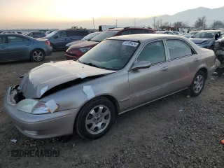 2002 Mazda 626 LX with VIN 1YVGF22C525277646, listed as a Copart auction lot 83109424 with 202,380 mi miles and Salvage Title. Bid and sale history available at carsss.com. Image 1.