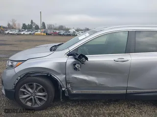 2021 Honda CR-V Touring with VIN 2HKRW2H9XMH212692, listed as a IAAI auction lot 41016640 with 24,149 mi miles. Bid and sale history available at carsss.com. Image 6.