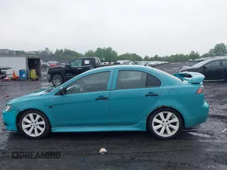2013 Mitsubishi Lancer GT with VIN JA32U8FW6DU022878, listed as a IAAI auction lot 42449708 with 121,869 mi miles and . Bid and sale history available at DreamBid. Image 14.