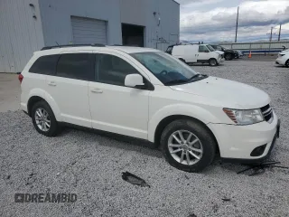 2013 Dodge Journey SXT with VIN 3C4PDDBG1DT619798, listed as a Copart auction lot 51820685 with 209,404 mi miles and Salvage Title. Bid and sale history available at DreamBid. Image 4.