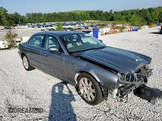 2005 Jaguar XJ with VIN SAJWA79C65SG45989, listed as a Copart auction lot 65357044 with 103,587 mi miles and Salvage Title. Bid and sale history available at carsss.com. Image 10.