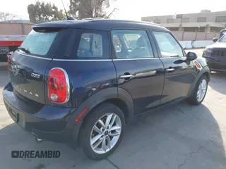 2014 MINI Countryman with VIN WMWZB3C50EWR42268, listed as a IAAI auction lot 41845750 with 117,192 mi miles and . Bid and sale history available at DreamBid. Image 4.