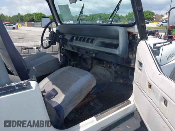 1990 Jeep Wrangler with VIN 2J4FY29T7LJ528844, listed as a IAAI auction lot 42354175 with 69,349 mi miles and . Bid and sale history available at DreamBid. Image 5.