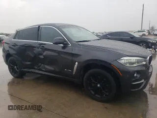 2015 BMW X6 sDrive35i with VIN 5UXKU0C59F0F91881, listed as a Copart auction lot 69878554 with 120,065 mi miles and Salvage Title. Bid and sale history available at carsss.com. Image 4.