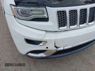 2014 Jeep Grand Cherokee Summit z VIN 1C4RJFJTXEC346627, wystawiony jako IAAI lot #42332200 z przebiegiem 231 007 mil mil oraz . Historia ofert i sprzedaży dostępna na DreamBid. Obrazek 6.